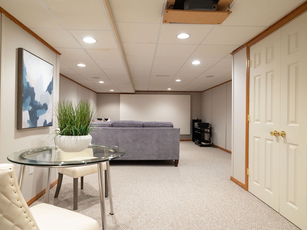 10 Livingston Road Wellesley, MA 02482 - Photo 32 of 36 a room with furniture and a chandelier