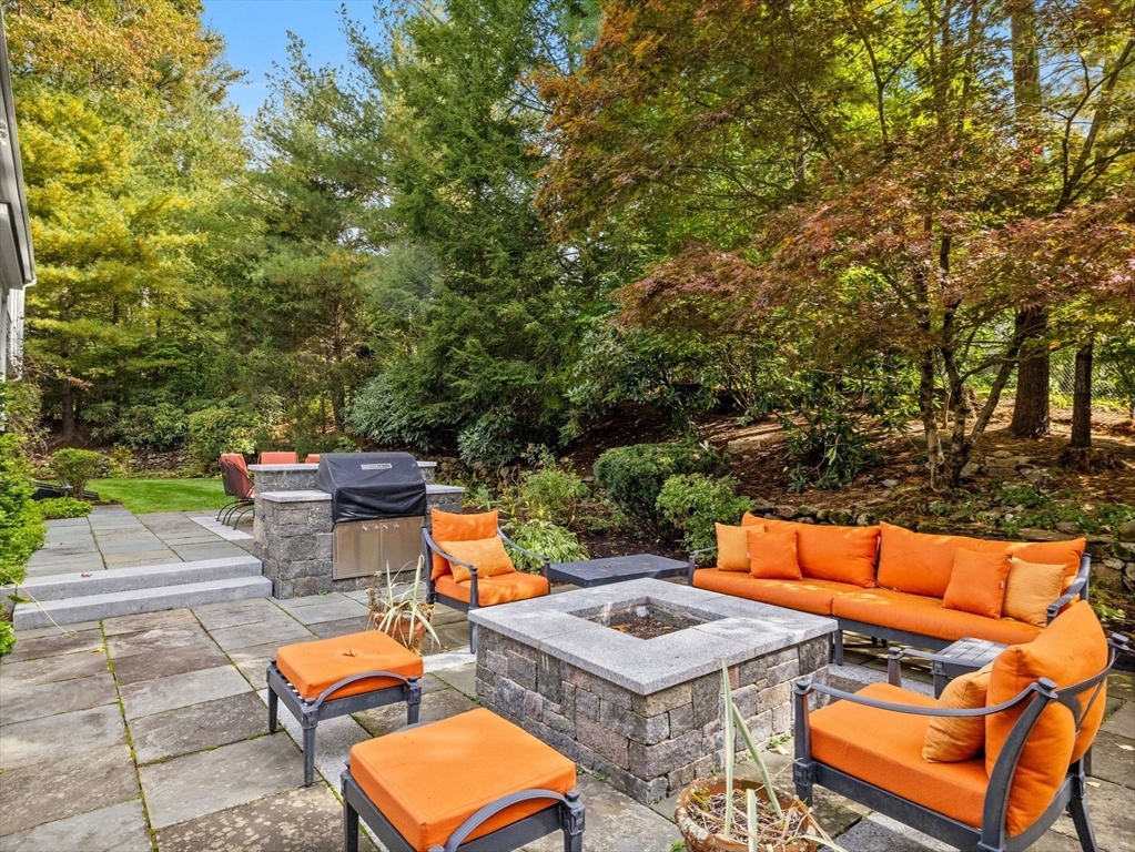 10 Livingston Road Wellesley, MA 02482 - Photo 36 of 36 an outdoor sitting area with a table and chairs
