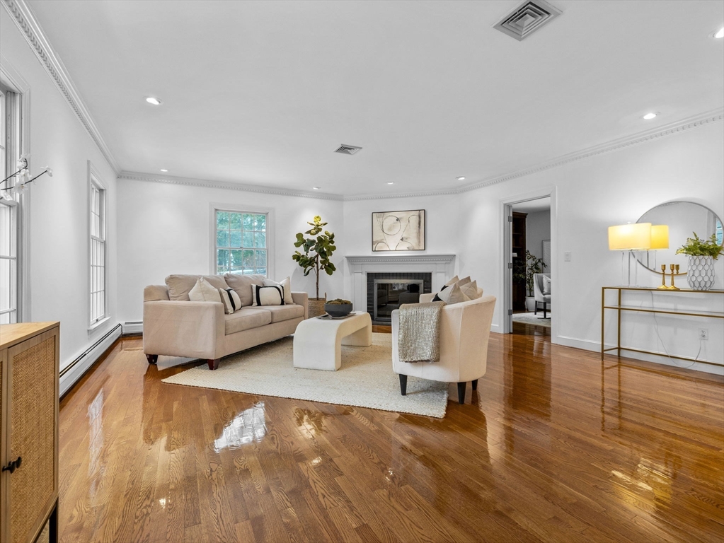 10 Livingston Road Wellesley, MA 02482 - Photo 4 of 36 a living room with furniture and a fireplace