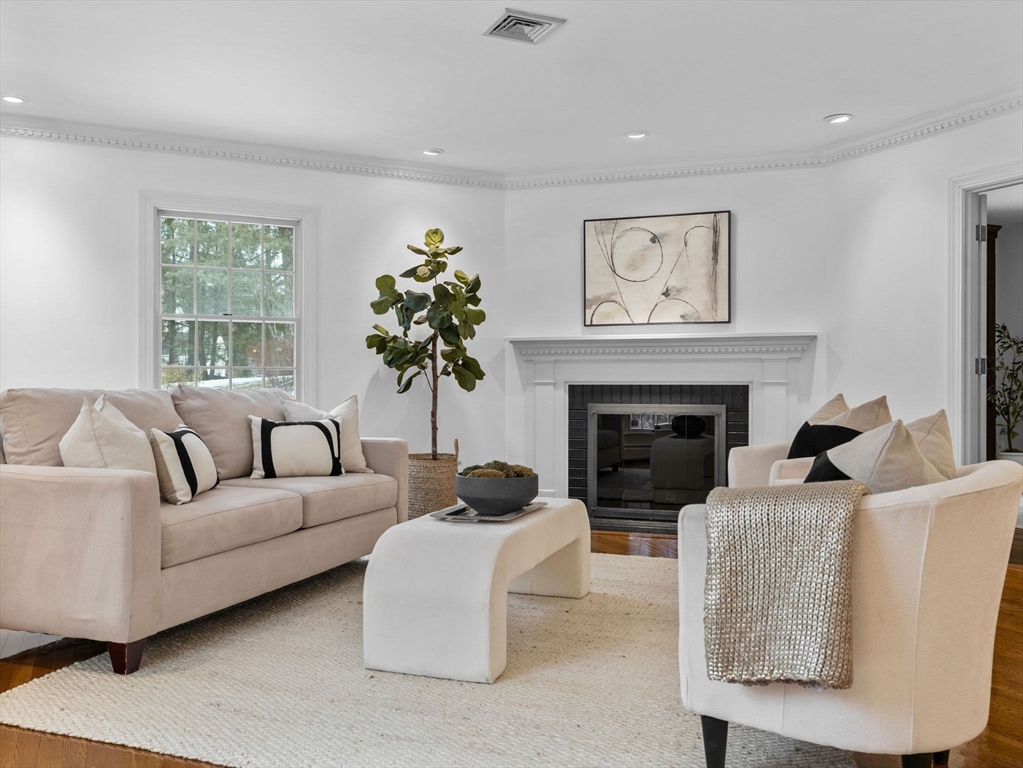10 Livingston Road Wellesley, MA 02482 - Photo 5 of 36 a living room with furniture and a fireplace