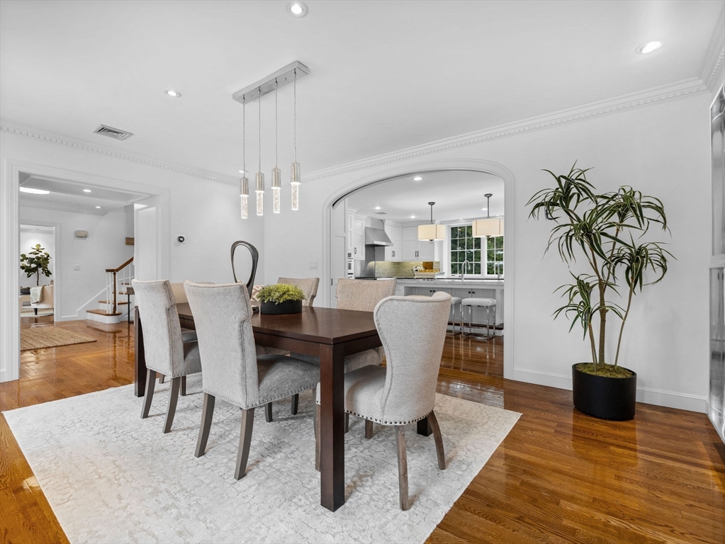 10 Livingston Road Wellesley, MA 02482 - Photo 7 of 36 a dining room with furniture potted plants and wooden floor