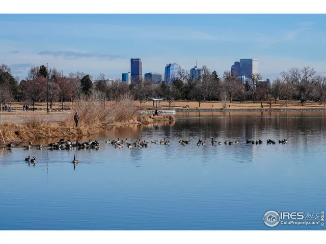 a view of a lake with tall buildings