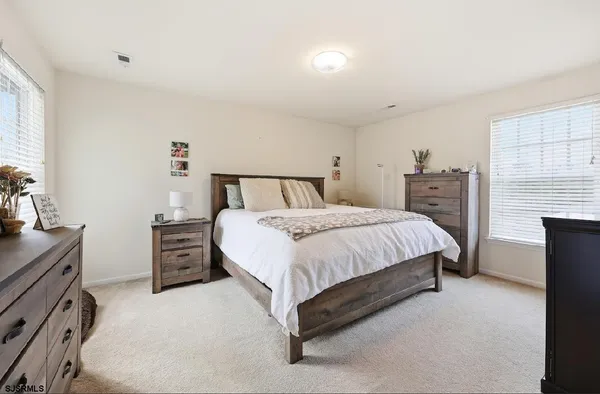 a bed room with a bed and a television