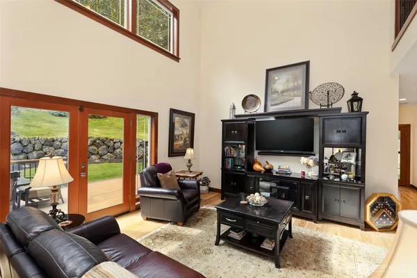 a kitchen with stainless steel appliances granite countertop a stove refrigerator and cabinets