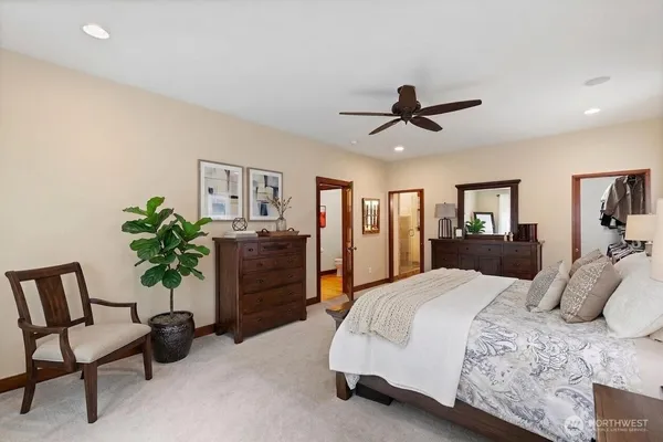 a bedroom with a bed dresser and a window