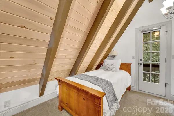 a bathroom with a double vanity sink a mirror and a shower