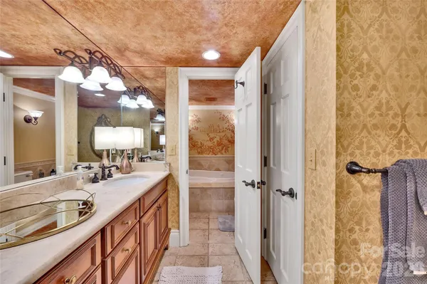 a bathroom with a sink a toilet and bathtub