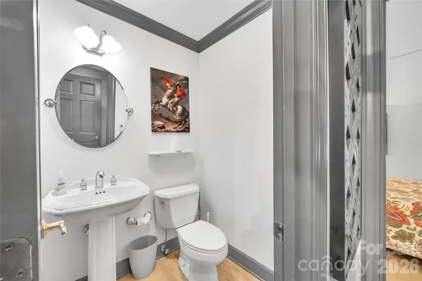 a dining room with furniture and a chandelier