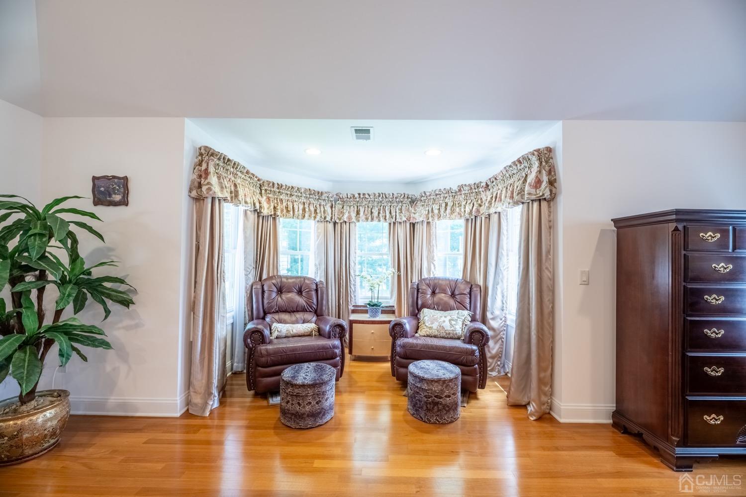 213 Oxford Road Edison, NJ 08820 - Photo 54 of 96 a living room with furniture and a large window