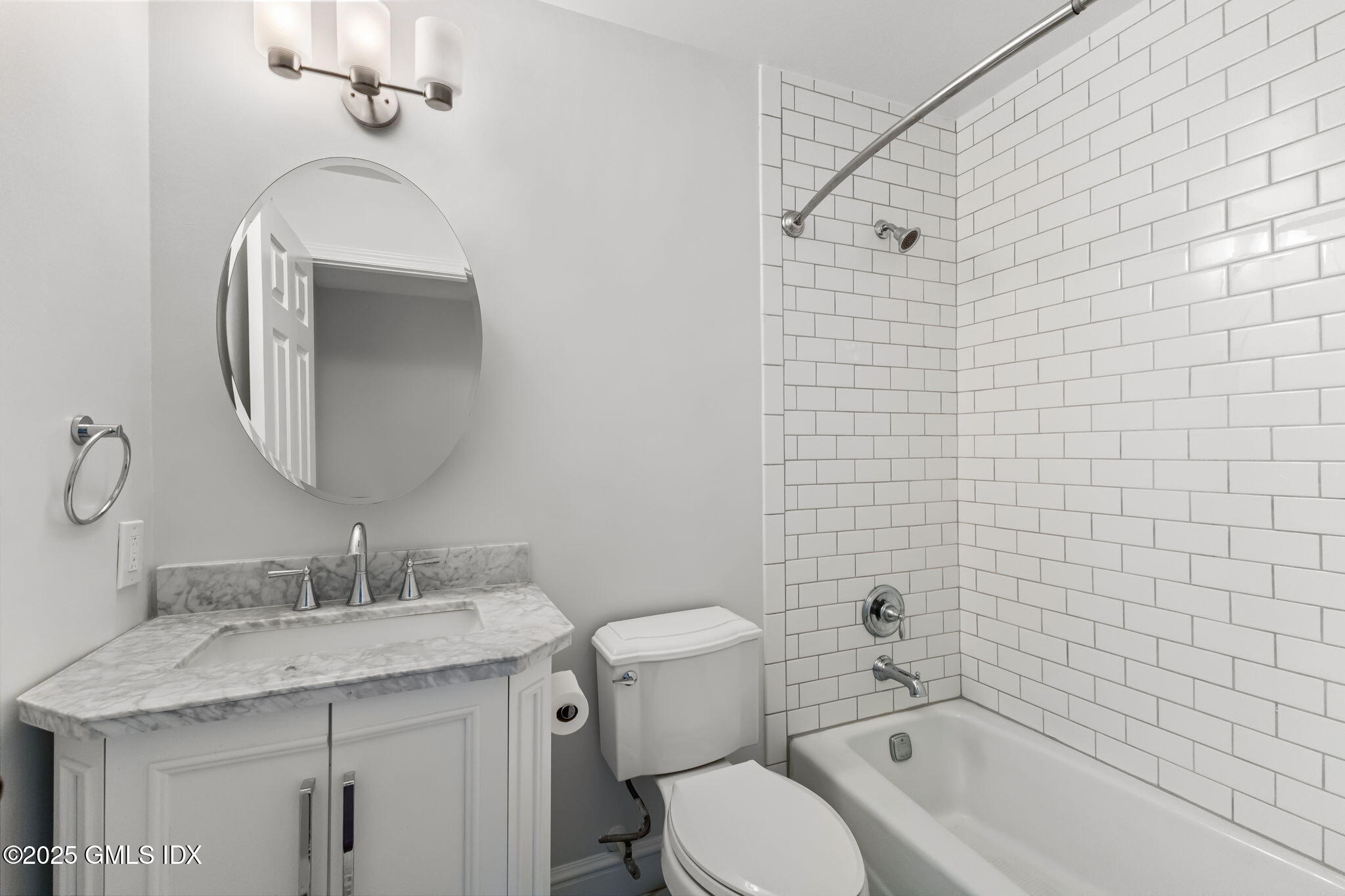 11 River Road, Unit 105 Cos Cob, CT 06807 - Photo 13 of 20 a bathroom with a granite countertop sink toilet and shower