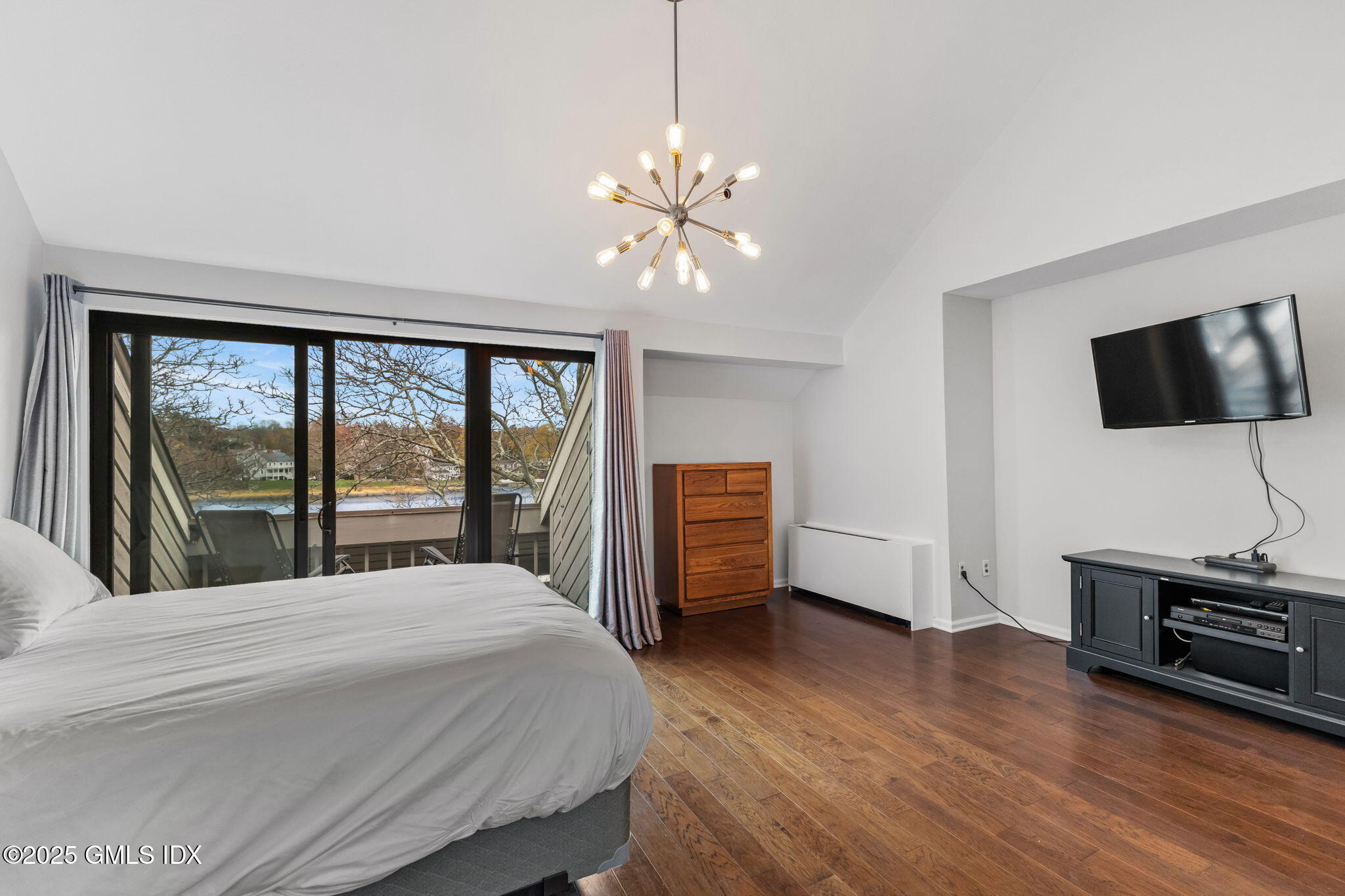 11 River Road, Unit 105 Cos Cob, CT 06807 - Photo 14 of 20 a bedroom with a bed and a flat screen tv