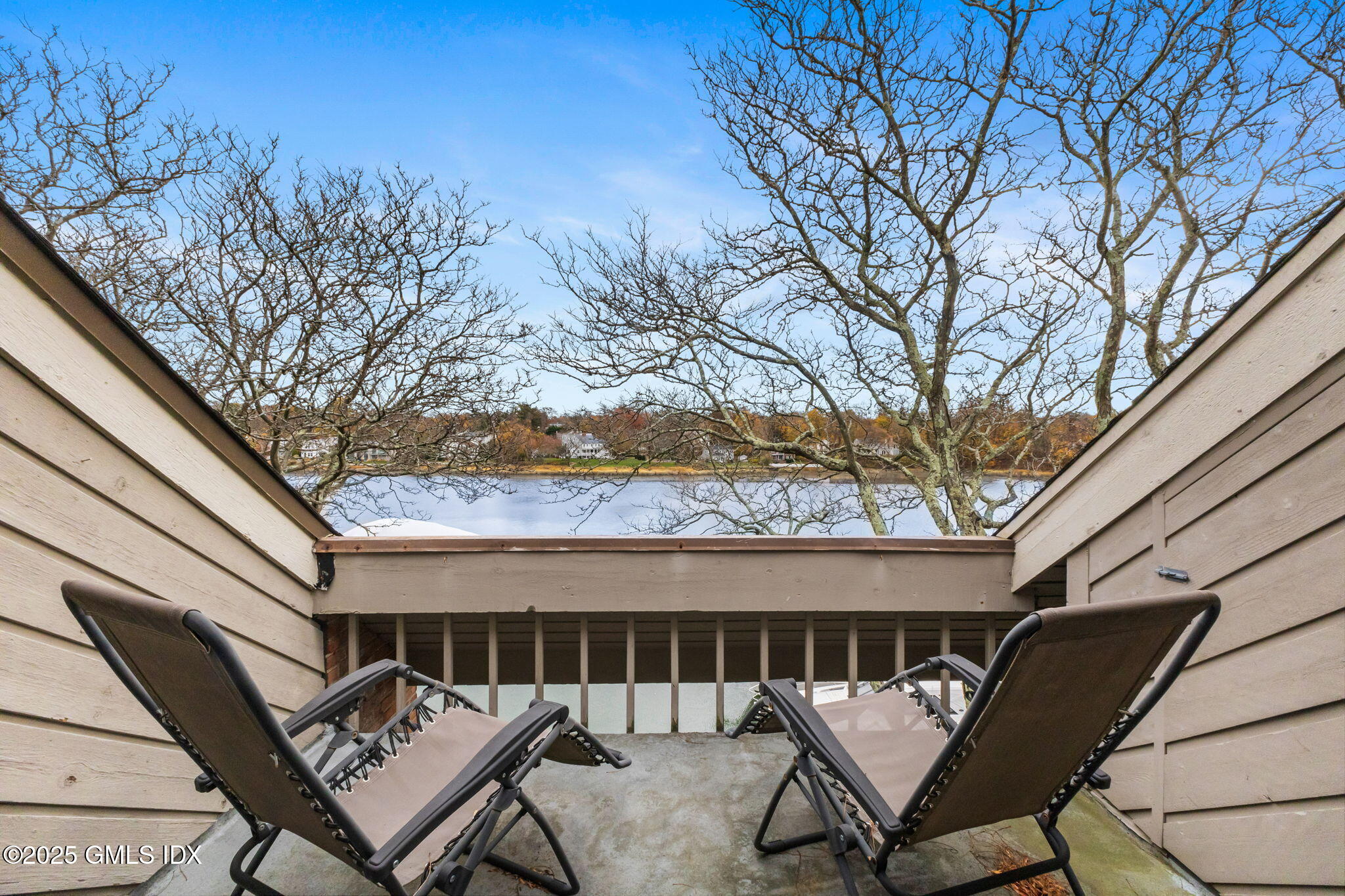 11 River Road, Unit 105 Cos Cob, CT 06807 - Photo 17 of 20 a roof deck with a table and chairs