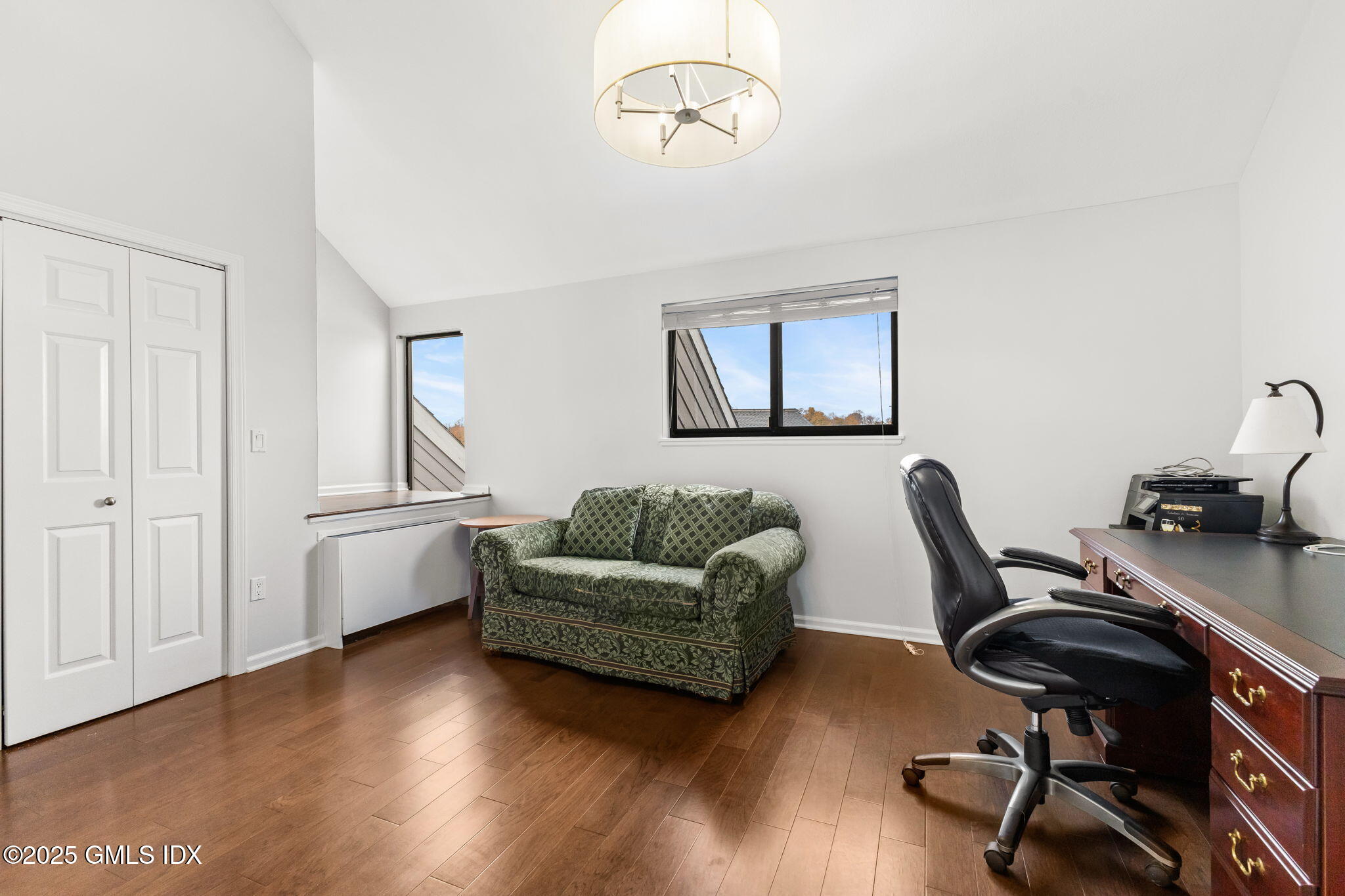 11 River Road, Unit 105 Cos Cob, CT 06807 - Photo 18 of 20 a view of a livingroom with workspace and a couch