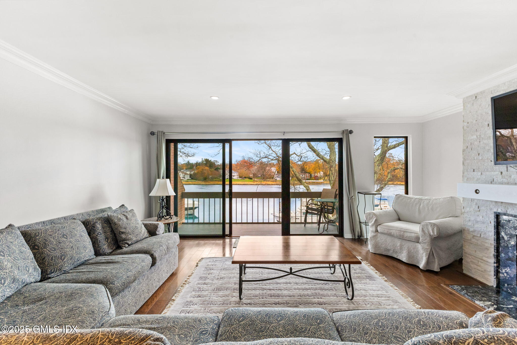 11 River Road, Unit 105 Cos Cob, CT 06807 - Photo 6 of 20 a living room with furniture and a large window