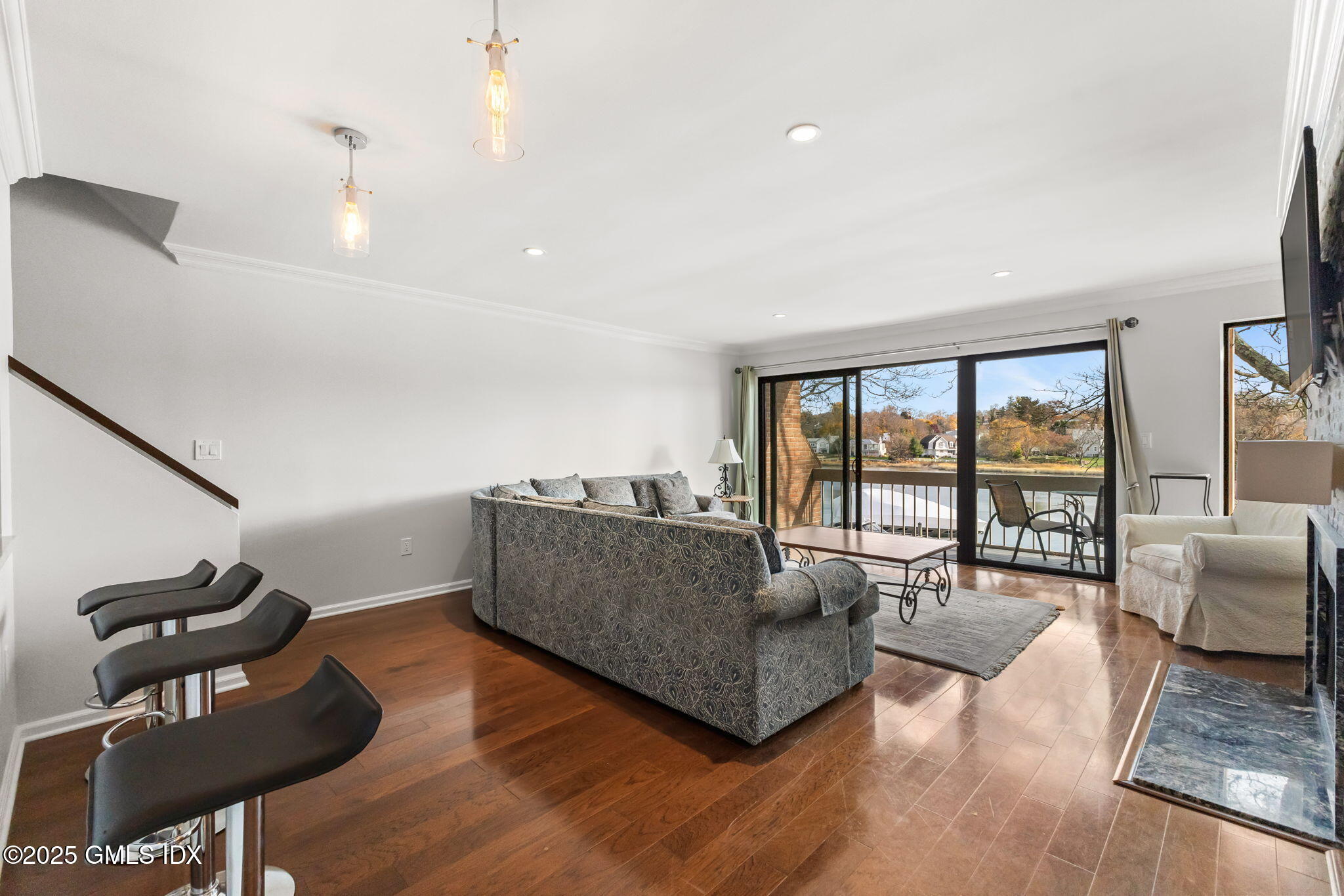 11 River Road, Unit 105 Cos Cob, CT 06807 - Photo 9 of 20 a living room with furniture and a large window