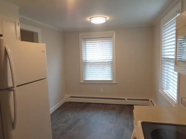 a white refrigerator freezer and a window