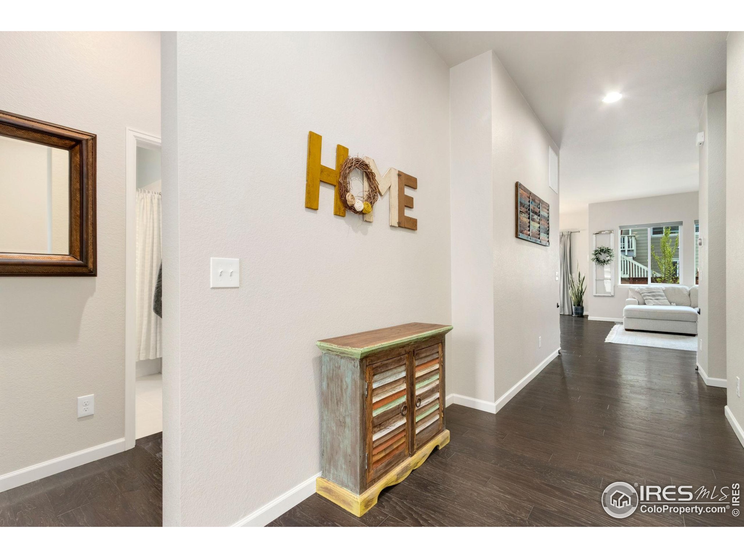 719 Wagon Bend Road Berthoud, CO 80513 - Photo 37 of 40 a view of a livingroom with wooden floor
