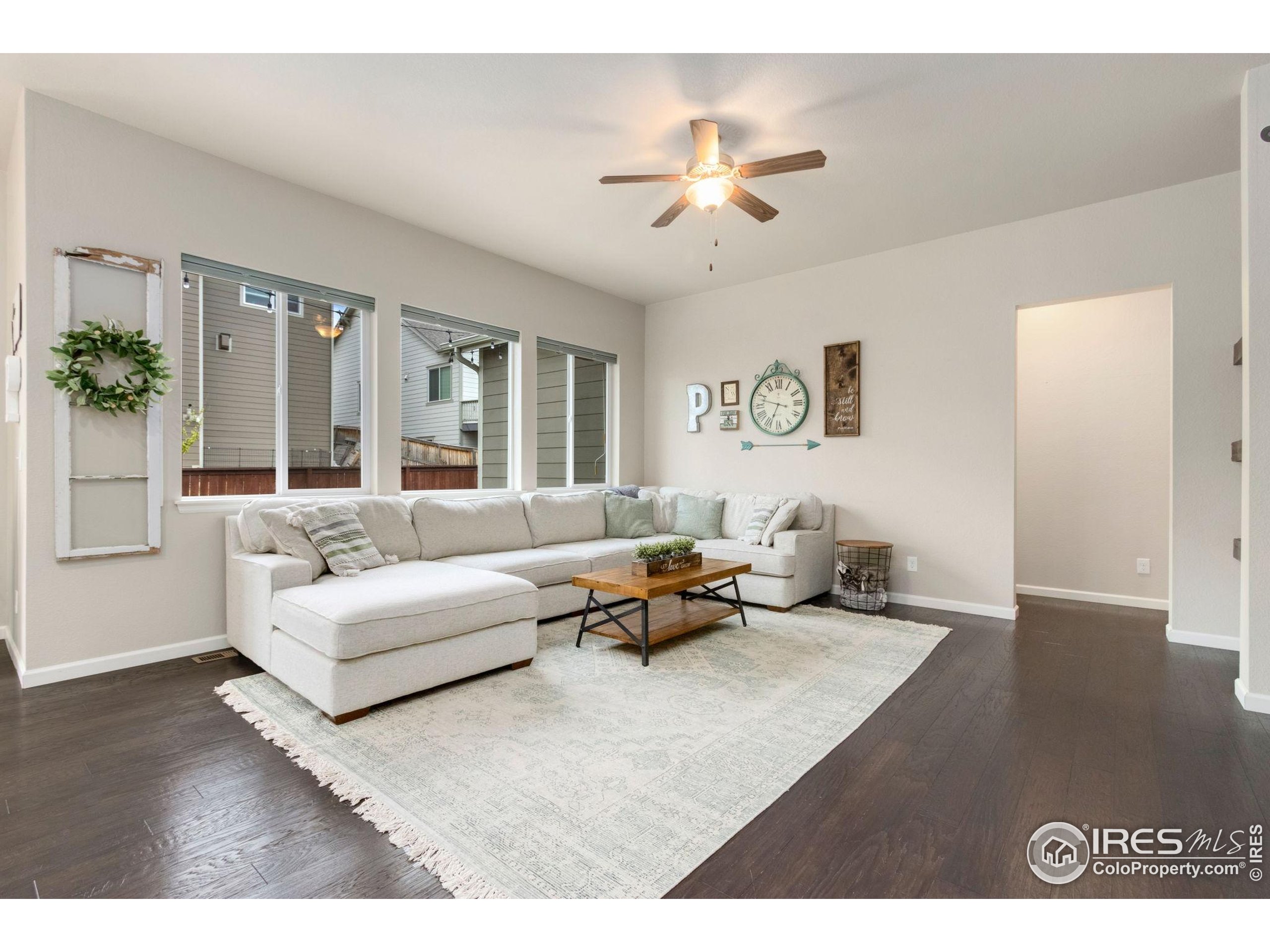 719 Wagon Bend Road Berthoud, CO 80513 - Photo 5 of 40 a living room with furniture and a large window