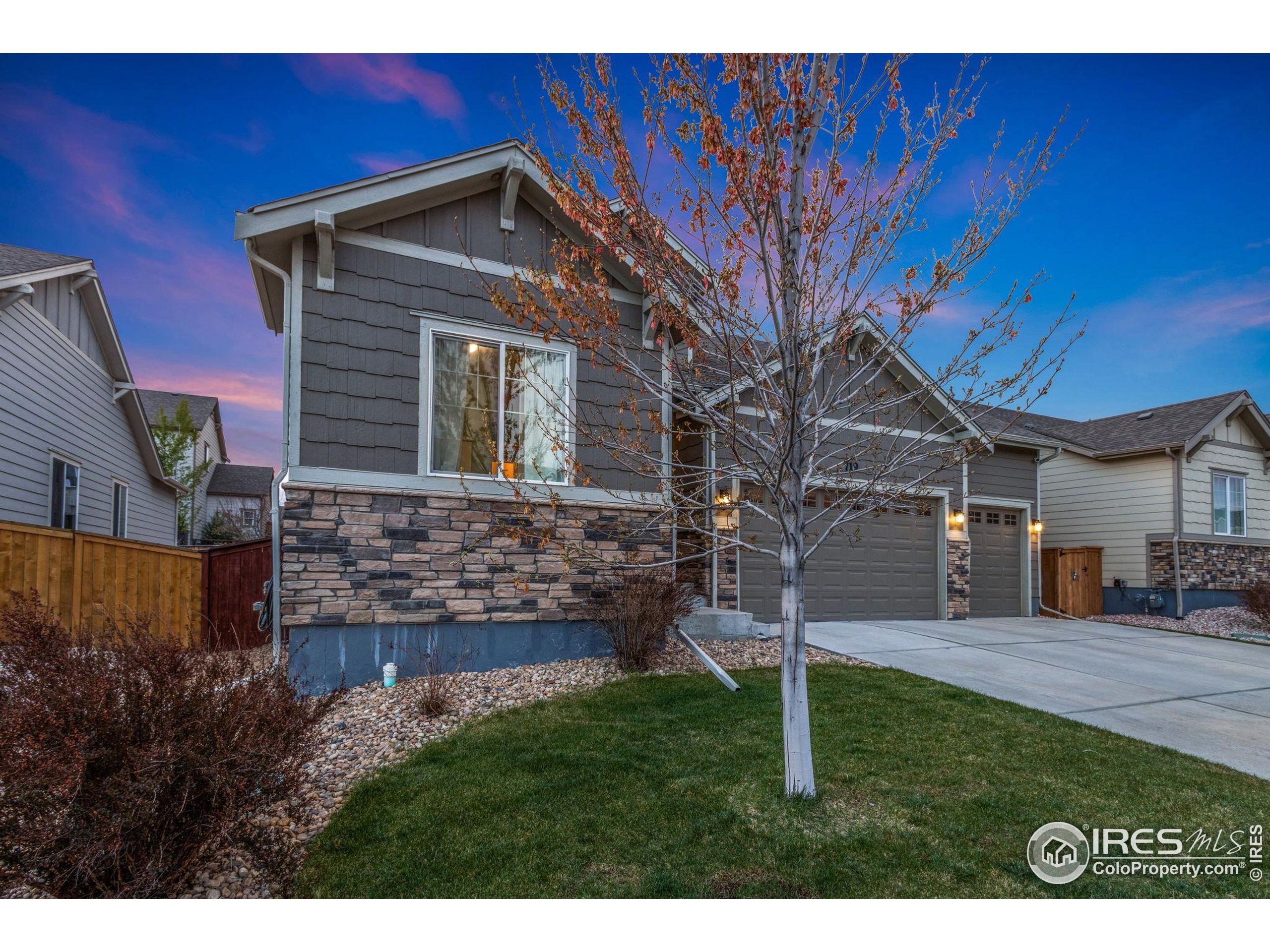 719 Wagon Bend Road Berthoud, CO 80513 - Photo 9 of 40 a front view of a house with a yard