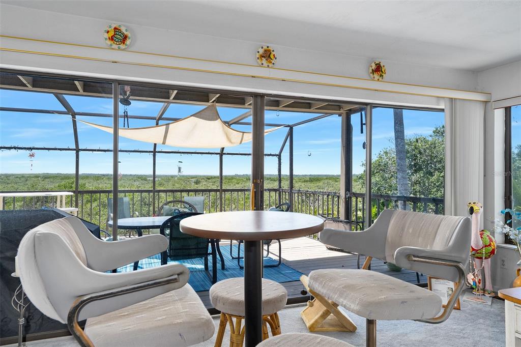 14 Marsh Court Ponce Inlet, FL 32127 - Photo 14 of 64 a living room with furniture and a large window