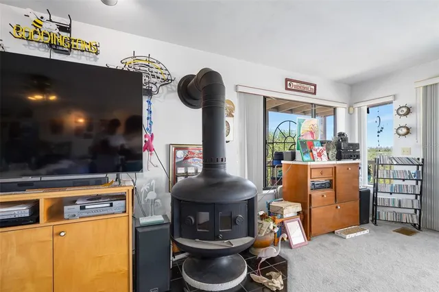 a spacious bedroom with a bed couch and a window