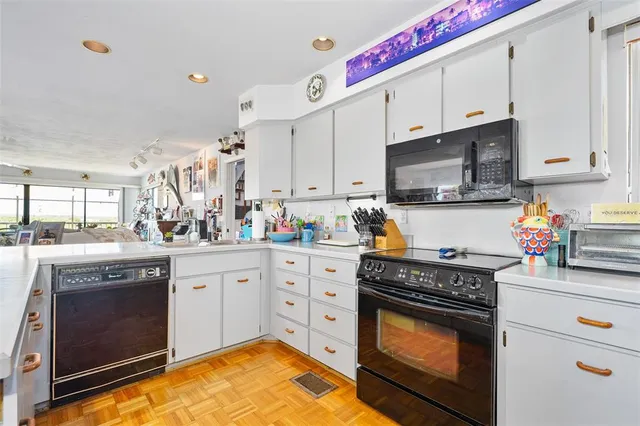 a living room with furniture and white walls