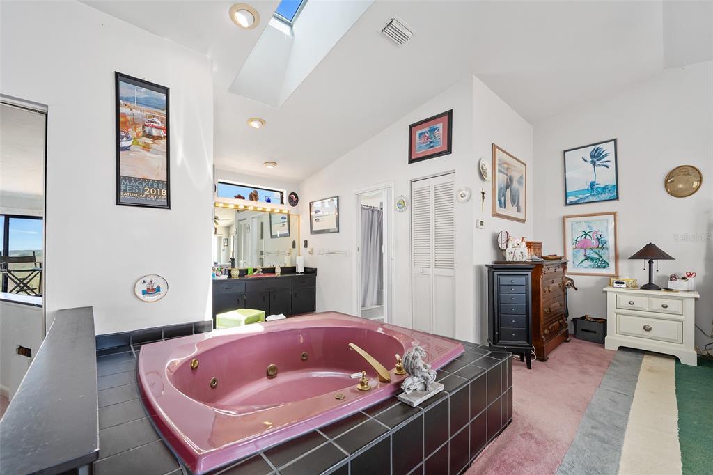 14 Marsh Court Ponce Inlet, FL 32127 - Photo 27 of 64 a bed room with a bed and furniture