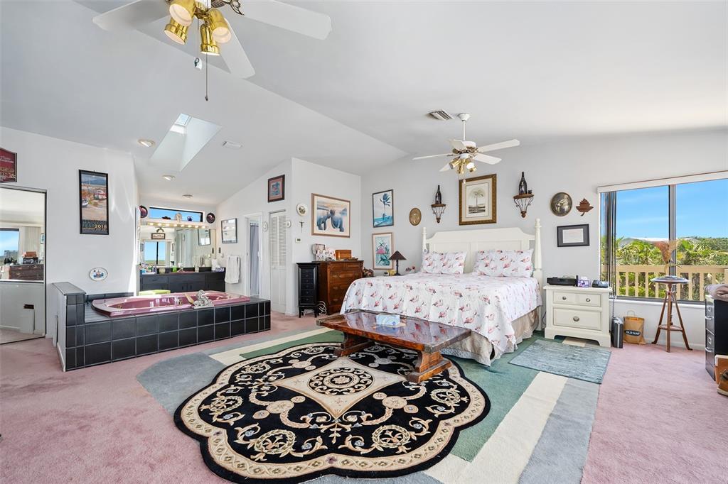 14 Marsh Court Ponce Inlet, FL 32127 - Photo 30 of 68 a bed room with furniture and a couch
