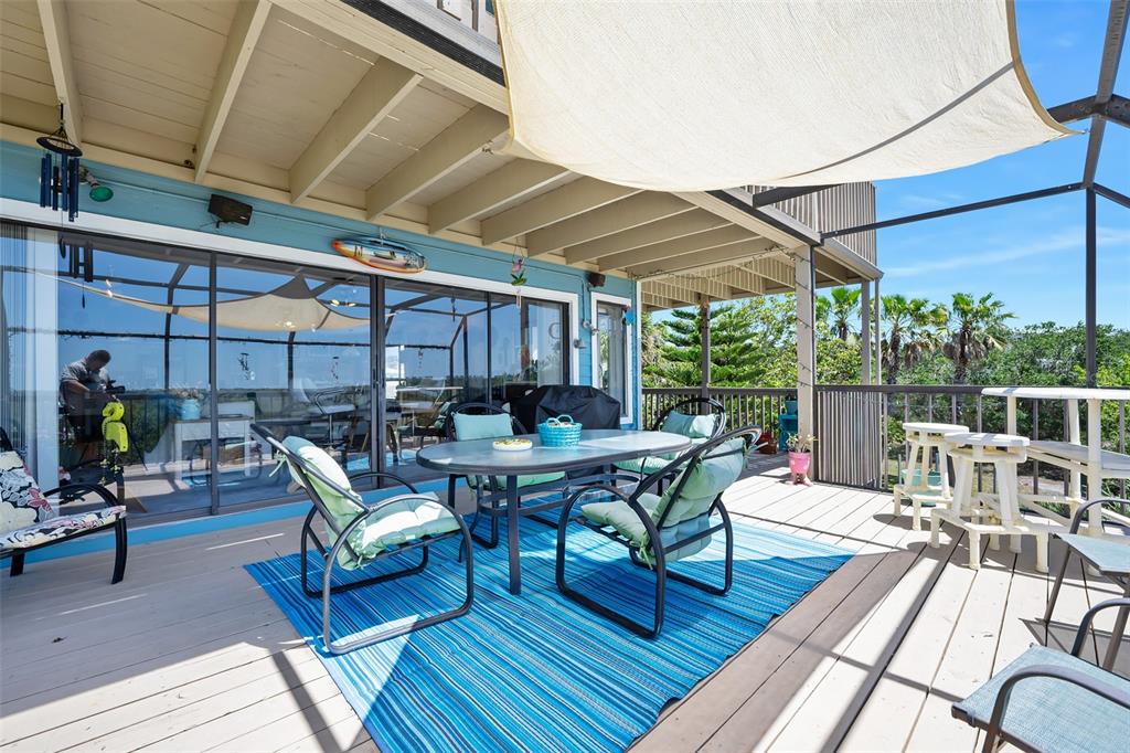 14 Marsh Court Ponce Inlet, FL 32127 - Photo 35 of 68 a outdoor space with patio the couches and a dining table with chairs