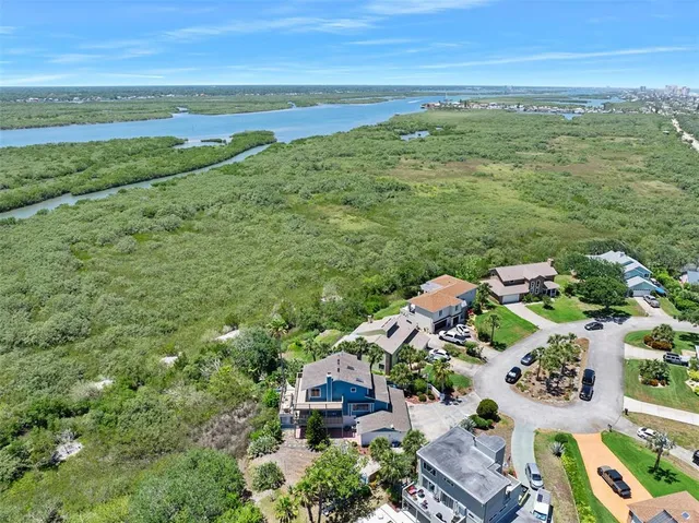 a balcony with wooden floor and fence