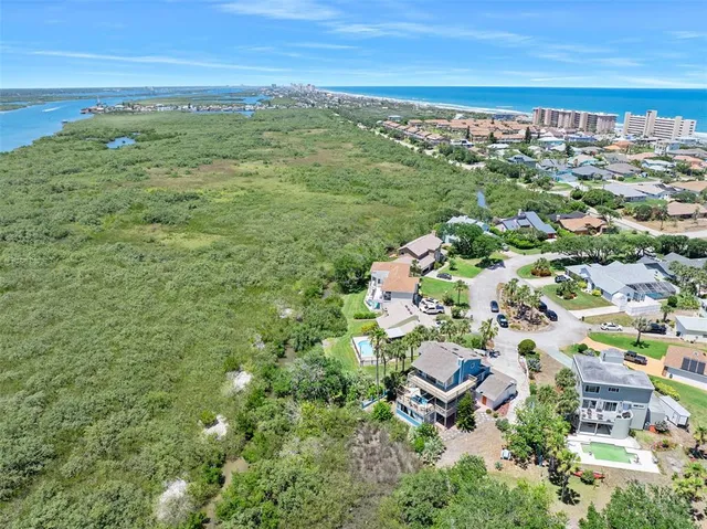 a balcony with wooden floor and city view