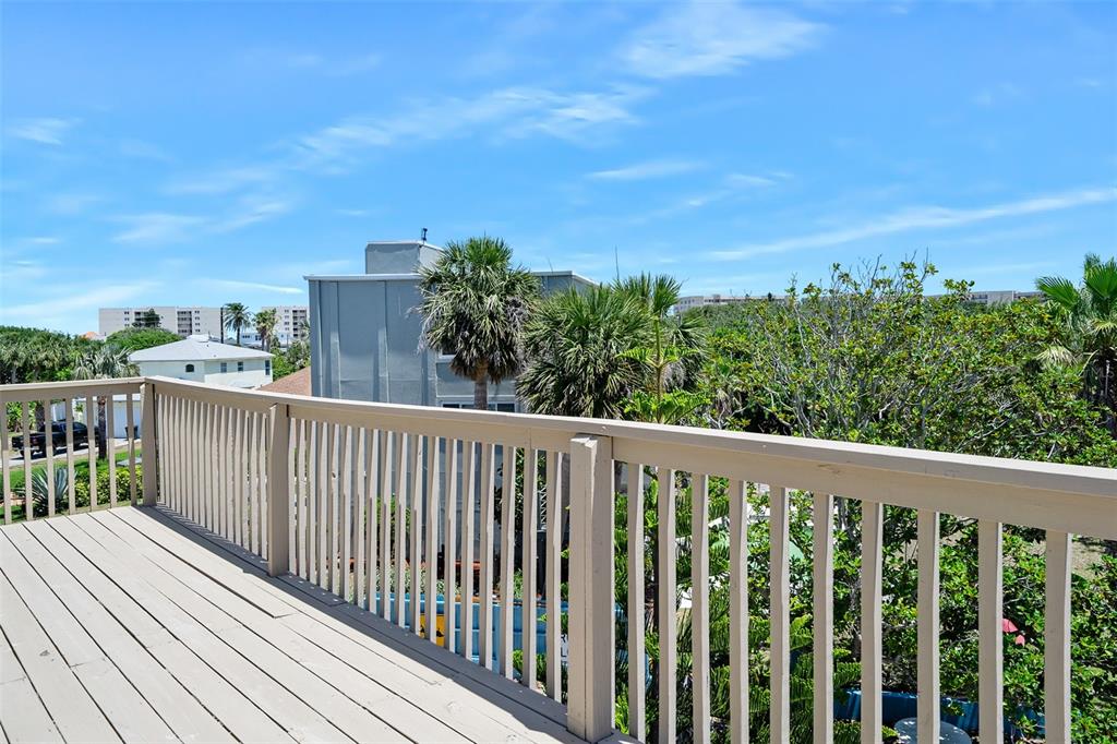 14 Marsh Court Ponce Inlet, FL 32127 - Photo 49 of 64 a balcony with wooden floor and city view