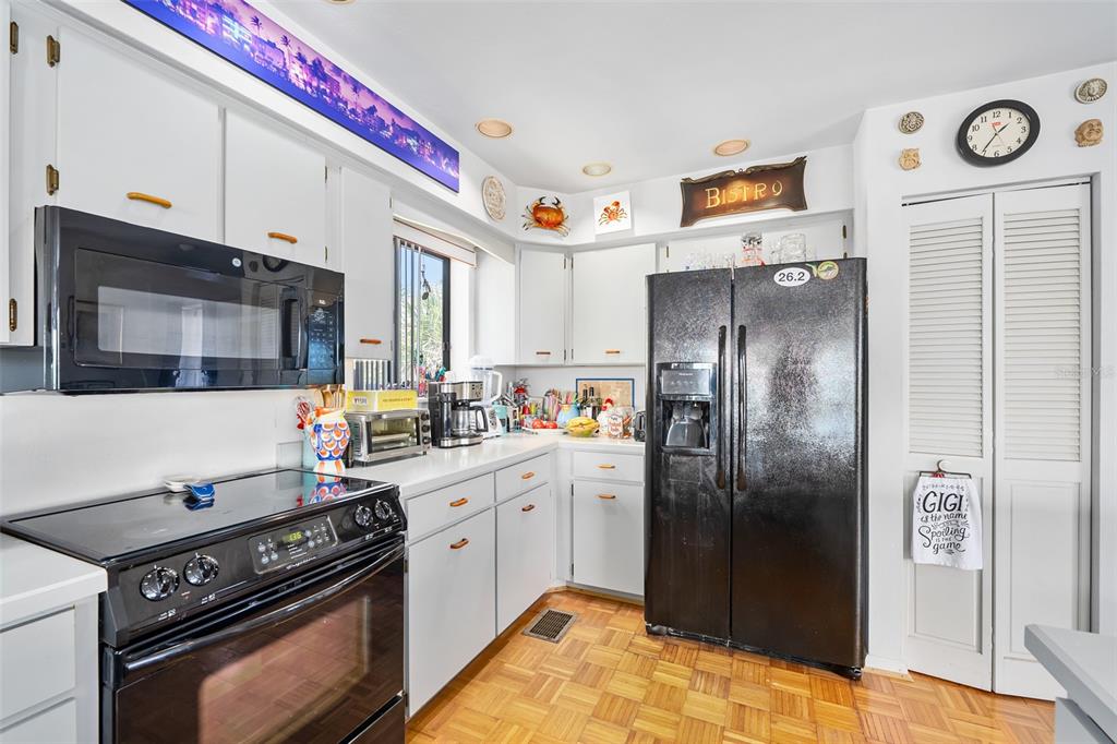 14 Marsh Court Ponce Inlet, FL 32127 - Photo 50 of 64 a kitchen with stainless steel appliances granite countertop a stove a refrigerator and a microwave