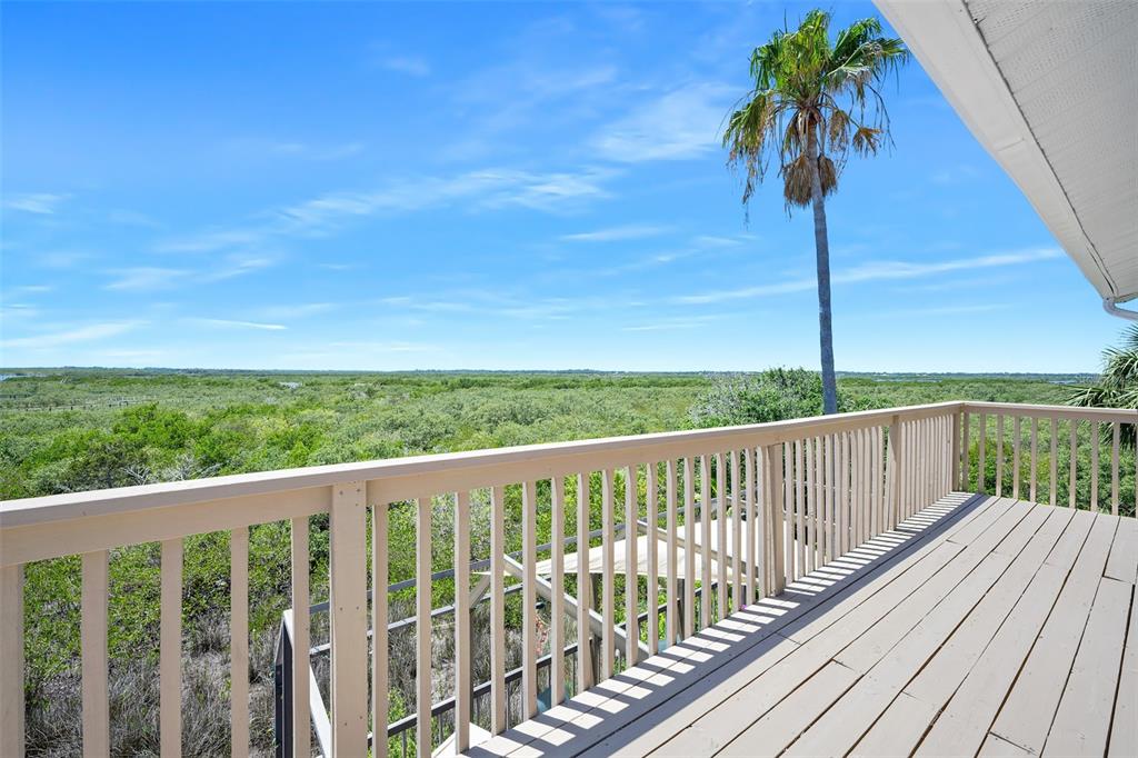 14 Marsh Court Ponce Inlet, FL 32127 - Photo 51 of 68 a balcony with wooden floor and fence