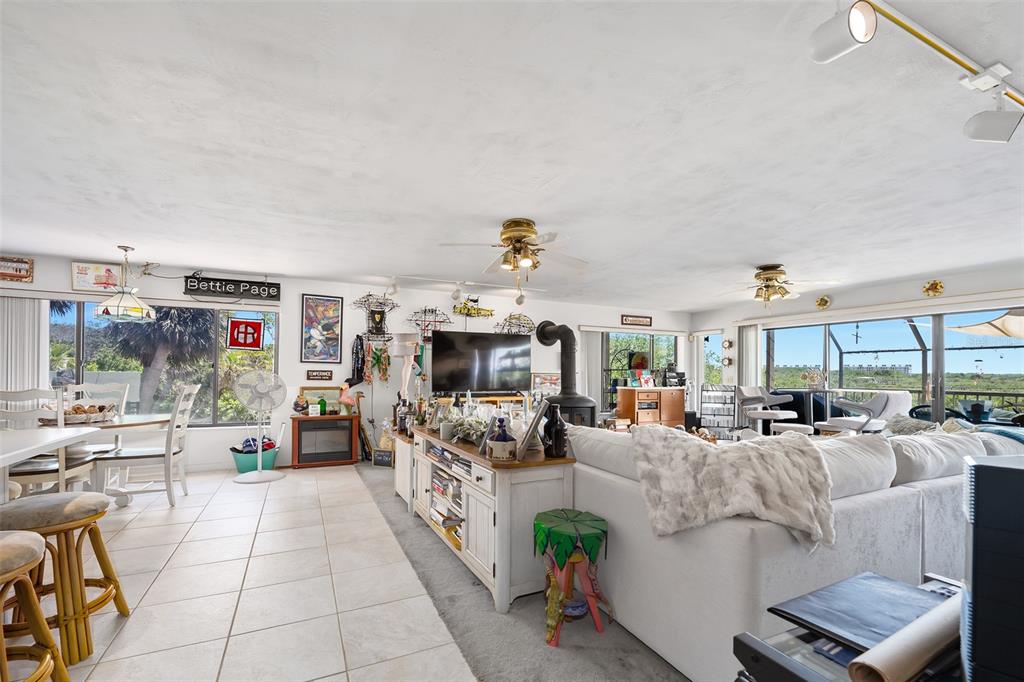 14 Marsh Court Ponce Inlet, FL 32127 - Photo 9 of 64 a living room with fireplace furniture and a flat screen tv
