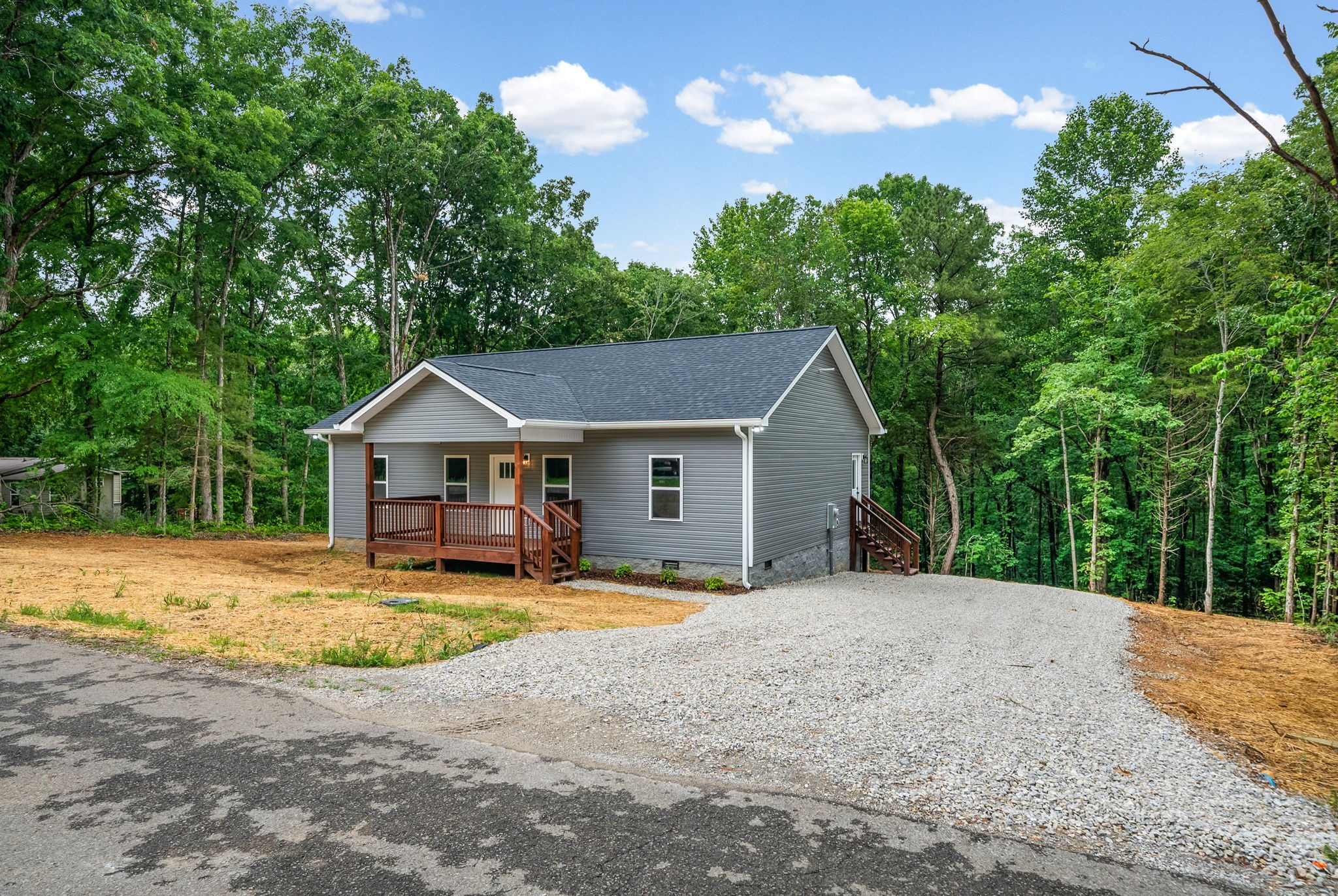 690 Brazzle Road Waverly, TN 37185 - Photo 4 of 35 a view of a house with large outdoor space and covered with trees