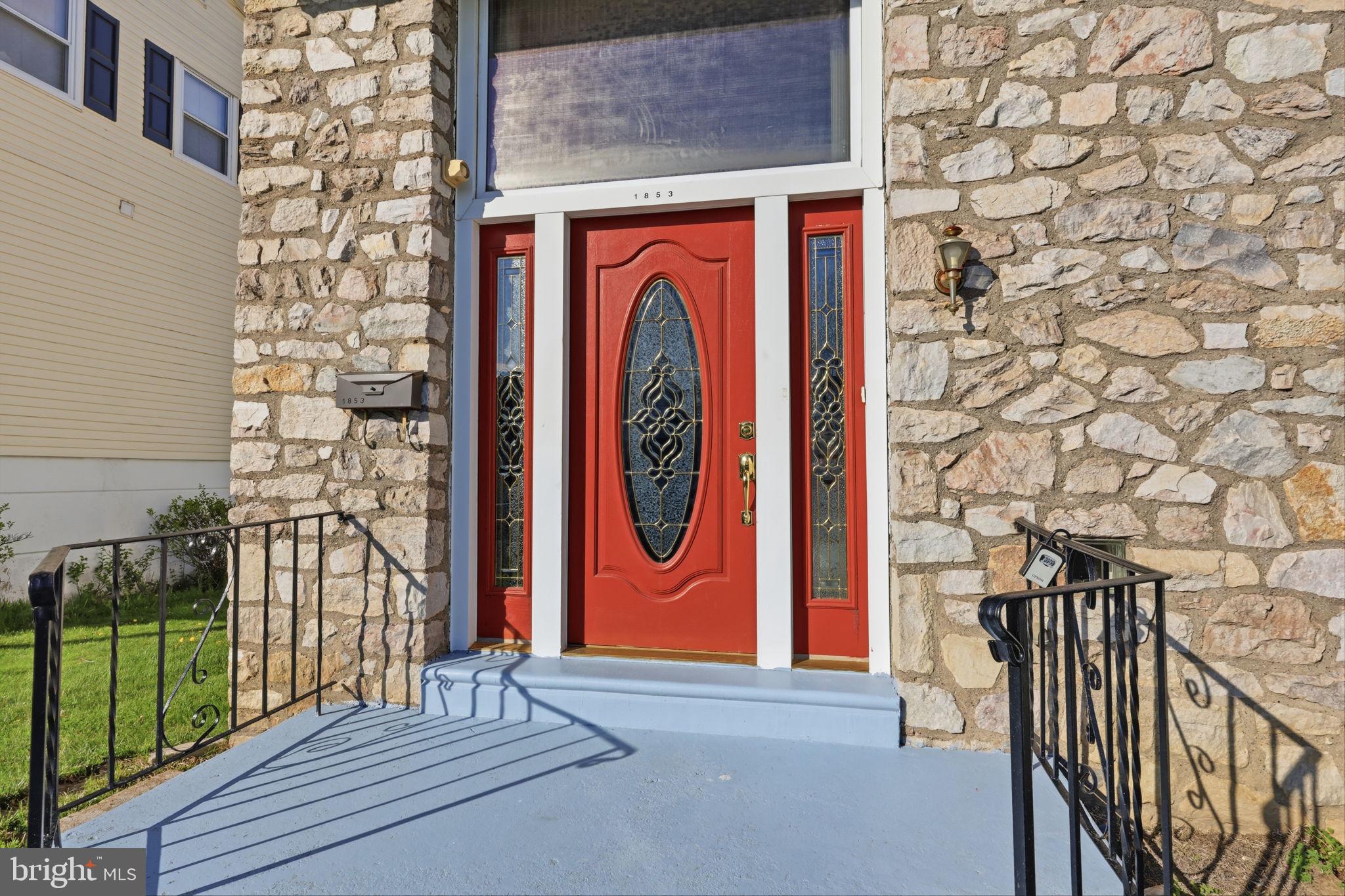 1853 Merlin Road Philadelphia, PA 19116 - Photo 4 of 41 Charming stone facade with vibrant door.