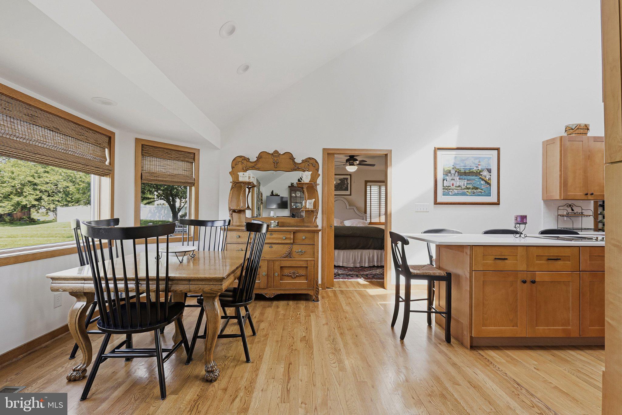 6495 Tides Road King George, VA 22485 - Photo 10 of 65 a view of a dining room with furniture and wooden floor