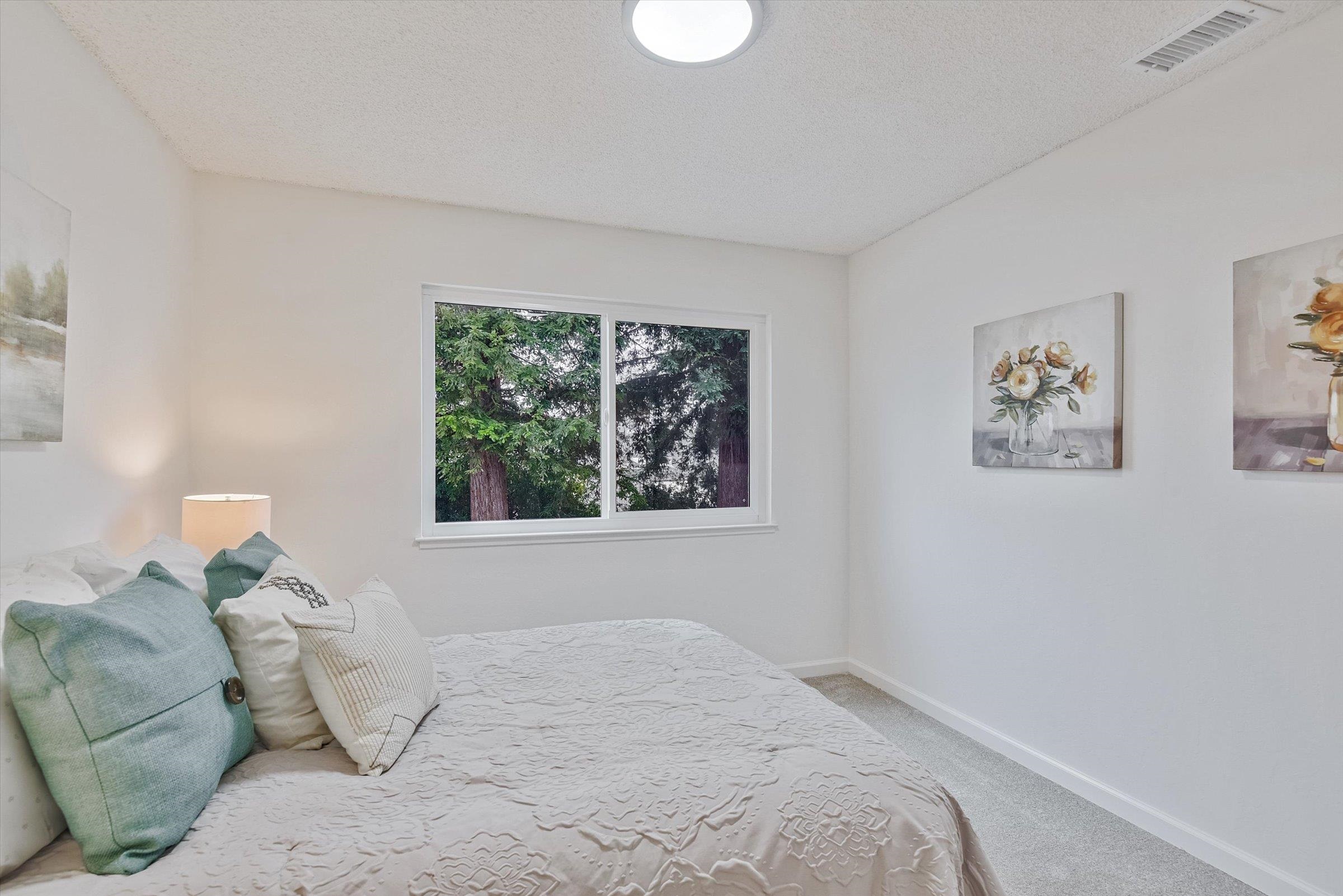1524 Ridgewood Drive Martinez, CA 94553 - Photo 13 of 33 a bed room with a bed and a window