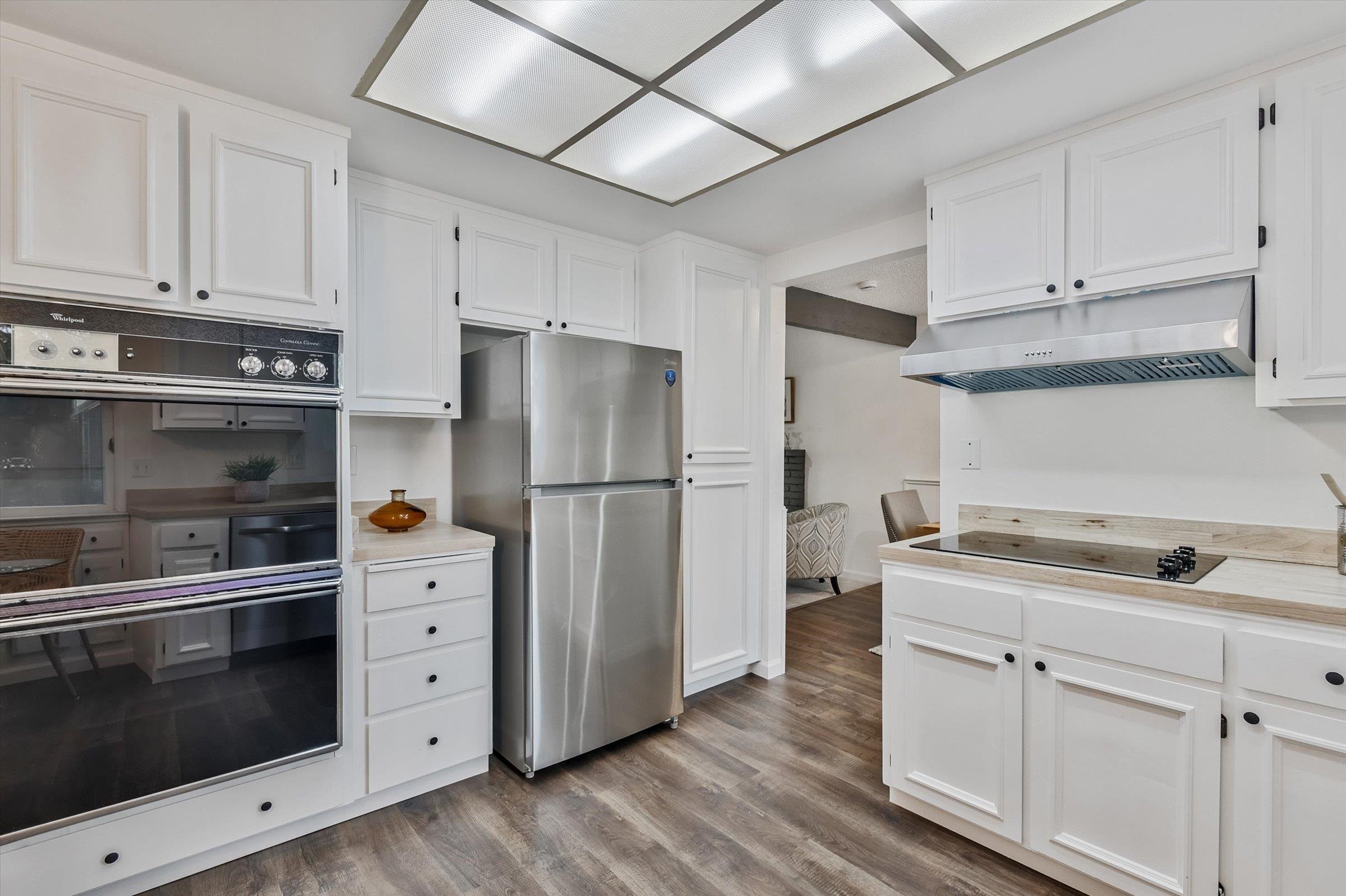 1524 Ridgewood Drive Martinez, CA 94553 - Photo 23 of 33 a kitchen with cabinets and stainless steel appliances
