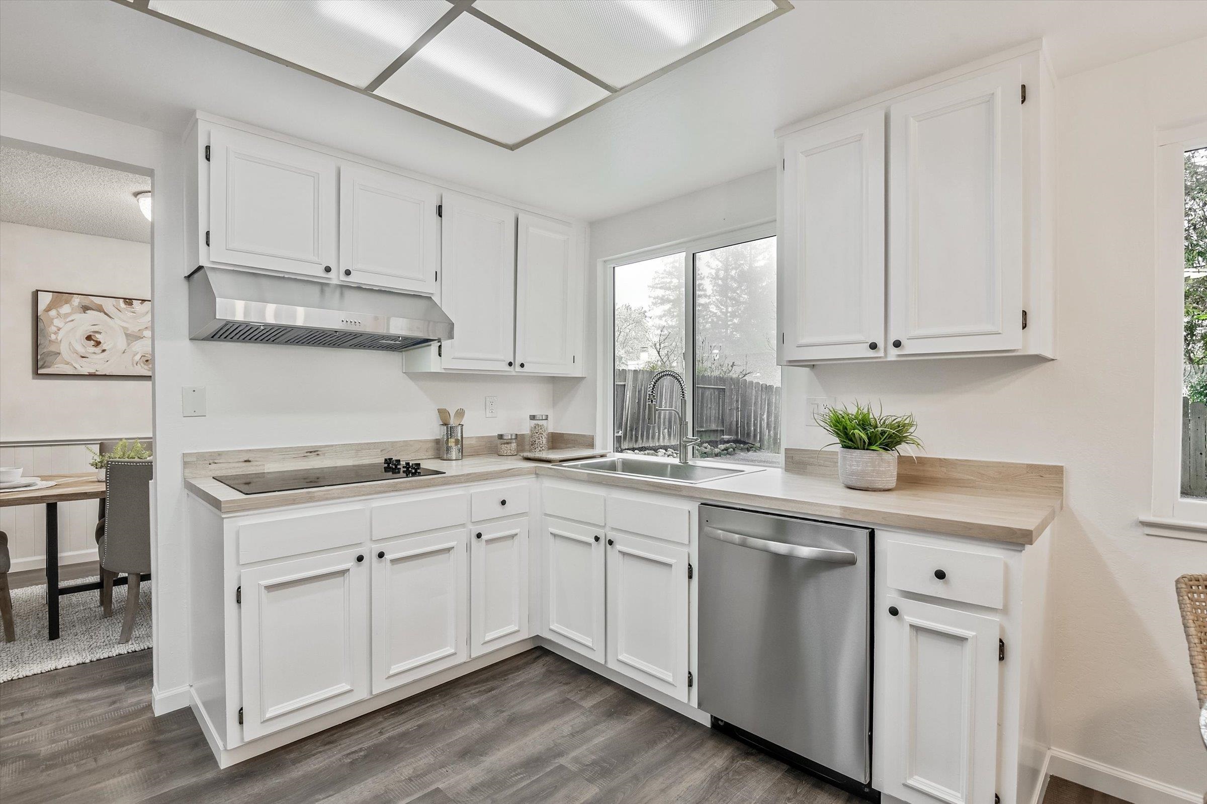 1524 Ridgewood Drive Martinez, CA 94553 - Photo 24 of 33 a kitchen with white cabinets sink and white stainless steel appliances