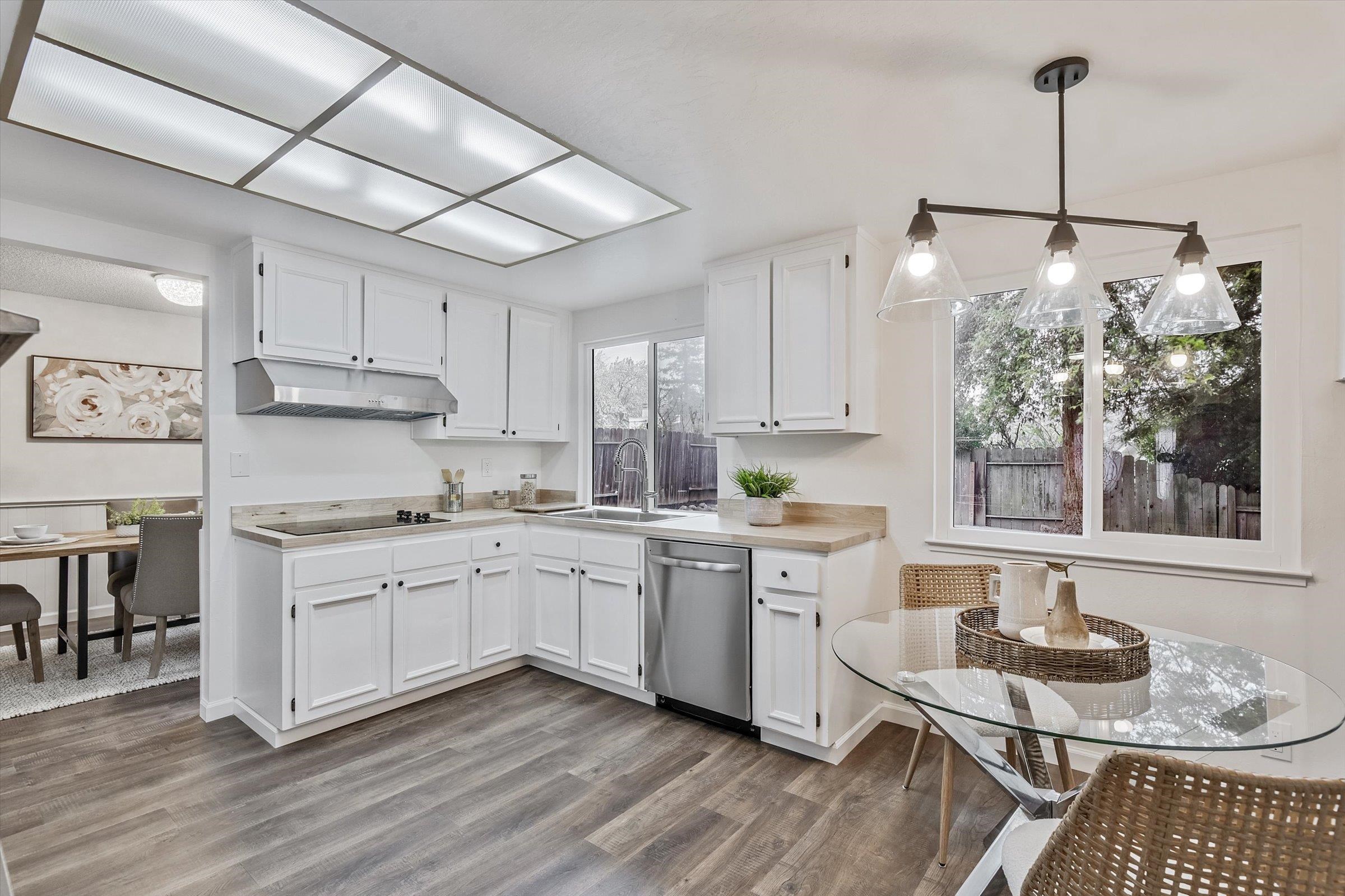 1524 Ridgewood Drive Martinez, CA 94553 - Photo 25 of 33 a kitchen with a sink stove and white cabinets