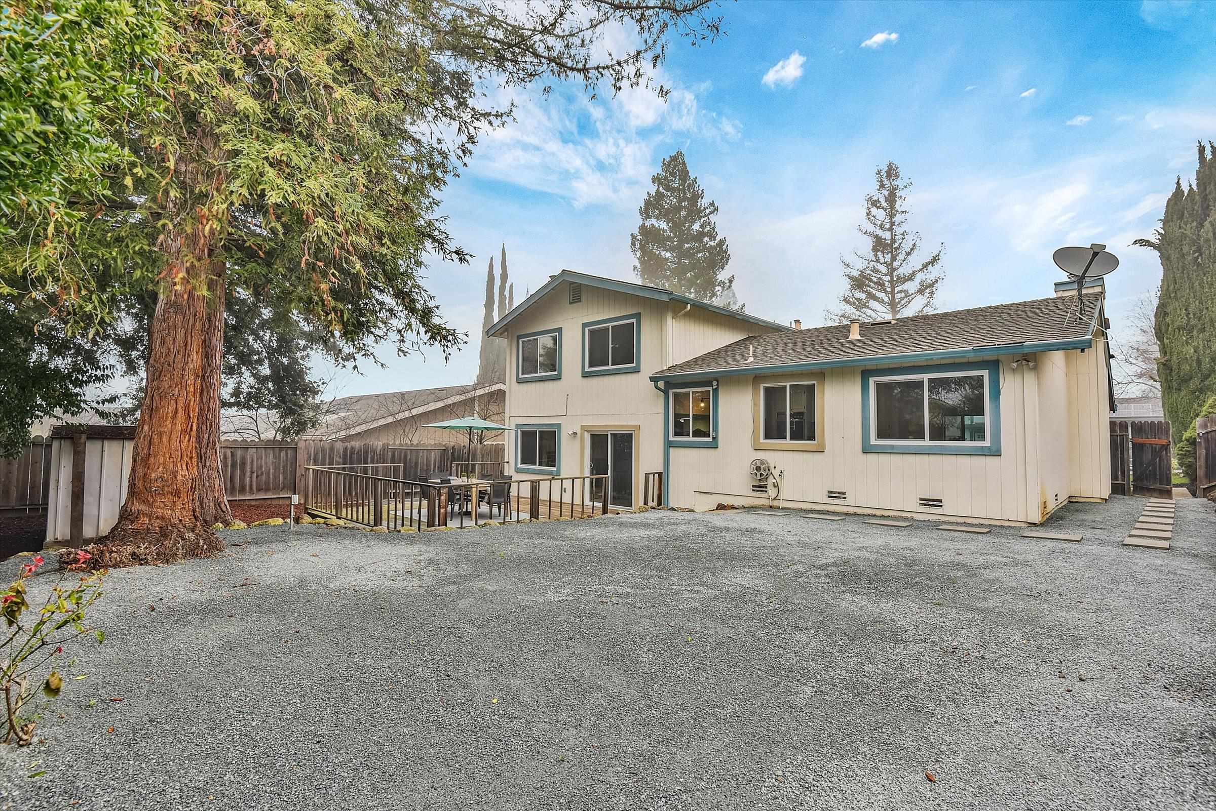 1524 Ridgewood Drive Martinez, CA 94553 - Photo 3 of 33 a view of a house with a large tree and a yard