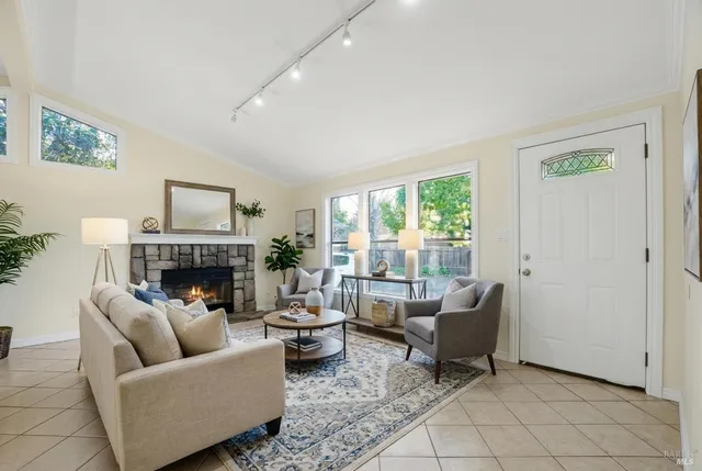 a bathroom with a granite countertop sink toilet a mirror and shower