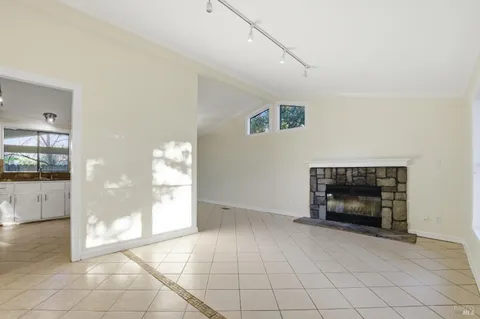 a bathroom with a granite countertop sink a mirror and a shower