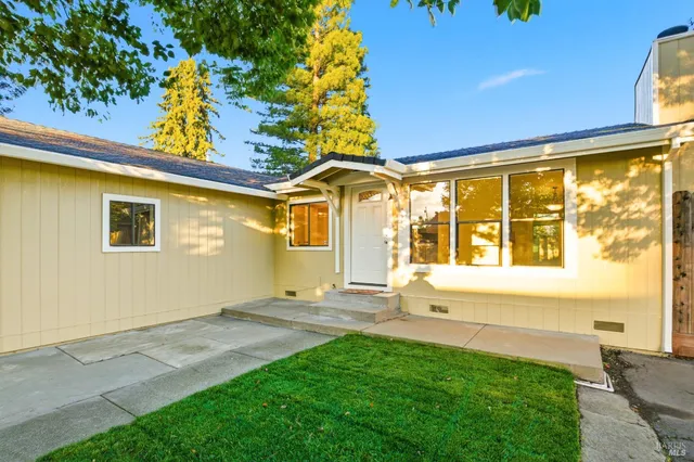 a view of a kitchen with granite countertop cabinets