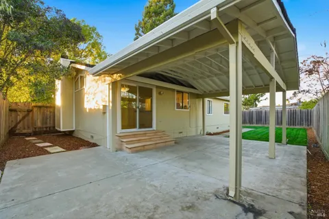 a kitchen with granite countertop a sink and a window