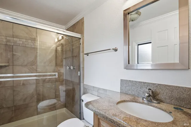 a bedroom with a bed chair and a window