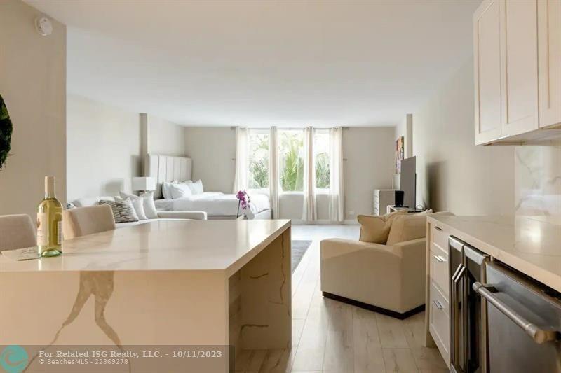 2301 Collins Avenue, Unit 327 Miami Beach, FL 33139 - Photo 3 of 11 a living room with furniture and a large window