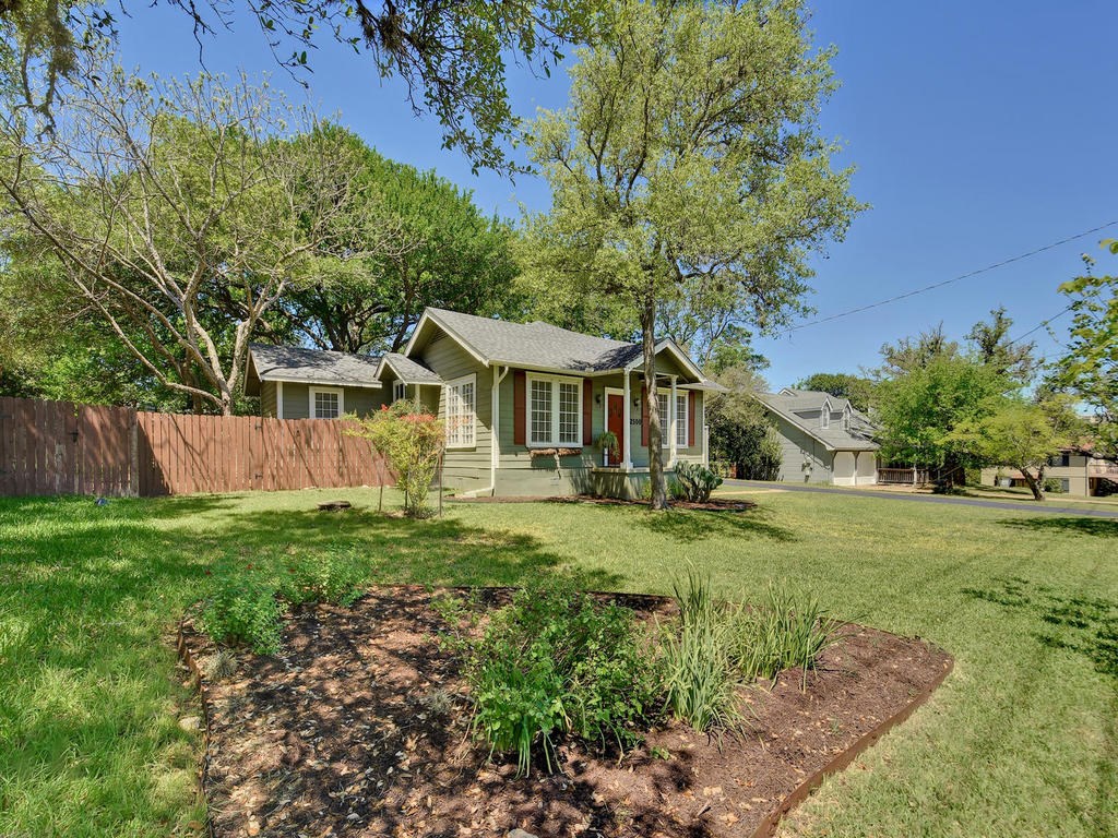 2500 Mecca Road Austin, TX 78733 - Photo 1 of 1 a front view of a house with a yard